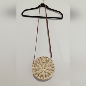 American Eagle straw bag with gold accent thread.